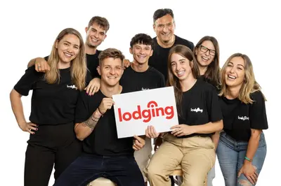 a group of people wearing black shirts holding a sign at Lodging Apartments Barceloneta Beach Studio P2 in Barcelona