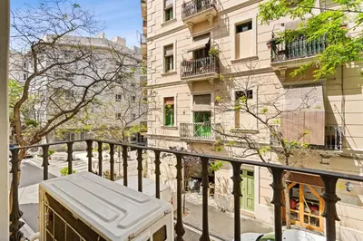 a box sitting on a balcony in front of buildings at Lodging Apartments Barceloneta Beach Studio P2 in Barcelona