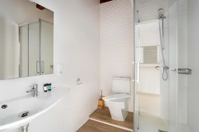 a bathroom with a sink and a toilet at The Collection Barcelona - Paseo de Gracia 5BD and 3BTH for 10 with Terrace in Barcelona