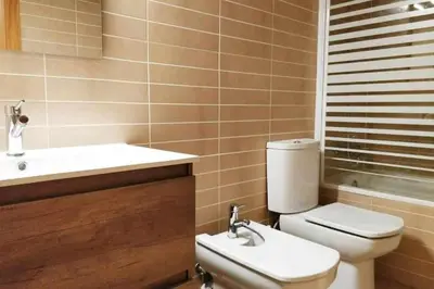 a bathroom with a toilet and a sink at Mazi Apartments Terrace in Mataró