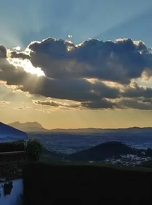 a view of the sunset from a hill at a18' de Barcelona y 10' de circuito de Cataluña in Barcelona