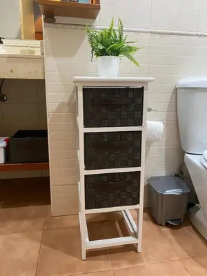 a white shelf with a plant on it in a bathroom at Apartamento tranquilo cerca de la Sagrada Familia in Barcelona