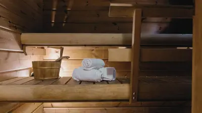 a sauna with two bunk beds and a towel at Finland House Barcelona- Ideal familias in Argentona