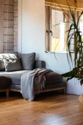 a living room with a couch and a window at Finland House Barcelona- Ideal familias in Argentona