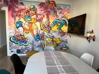 a table in a room with a painting on the wall at Charming appartement in the heart of Barcelona in Barcelona