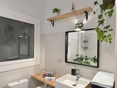 a bathroom with a sink and a mirror at Charming appartement in the heart of Barcelona in Barcelona