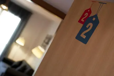 a door with a number sign on it at MH Apartments Gracia in Barcelona