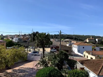 a view of a city from the roof of a house at Apartamento entero con vistas panorámicas in Avinyonet