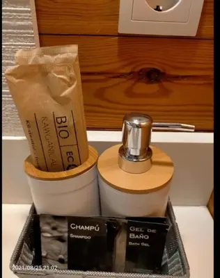 a counter top with a coffee maker and a box at Casa Flores del Mediterráneo in Badalona