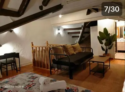 a living room with a couch and a table at Casa Flores del Mediterráneo in Badalona