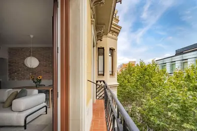 a balcony with a view of a building at Aspasios Garden Apartments in Barcelona