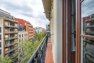 a balcony with a view of a city at Aspasios Garden Apartments in Barcelona