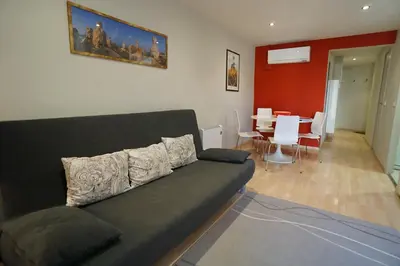 a living room with a couch and a dining room at Barcelona4Seasons - Gavina in Barcelona