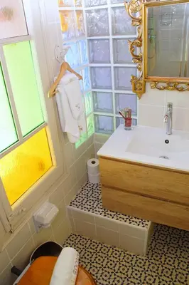 a bathroom with a sink and a mirror at Sitges Royal Rooms in Sitges