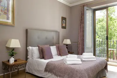 a bedroom with a bed with towels on it at Enjoy Apartments Gran Via in Barcelona