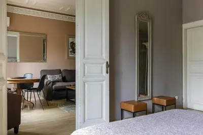 a room with a bed and a living room at Enjoy Apartments Gran Via in Barcelona