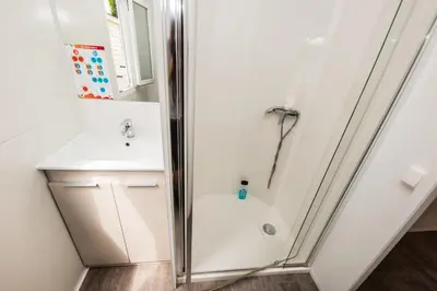a bathroom with a shower and a sink at Camping Bellsol Pets in Pineda de Mar