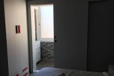 a bedroom with a door leading to a window at sagrada familia gaudi in Barcelona