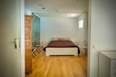 a bedroom with a bed in a room at Villa Maresme & Villa Rosa in Mataró
