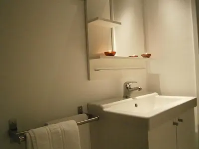 a bathroom with a sink and a mirror at Marbel Apartments in Barcelona