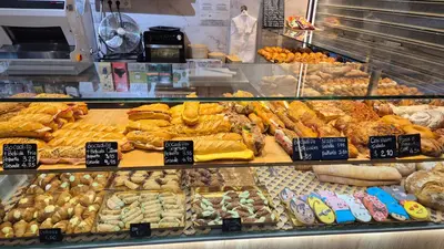 a bakery filled with lots of different types of bread at Apto, Ático Airport BCN, Cruise Port, Near beaches in Viladecáns