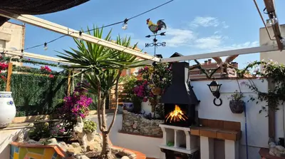 a patio with a bunch of plants and flowers at Apto, Ático Airport BCN, Cruise Port, Near beaches in Viladecáns