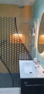 a bathroom with a white sink and a mirror at Apartamento Rosellón in Barcelona