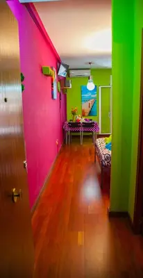 a room with a pink and green wall at Estudio Maignon in Barcelona