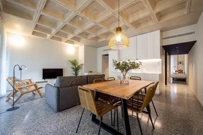 a living room with a table and a couch at Barcelona Touch Apartments - Rosich in Hospitalet de Llobregat