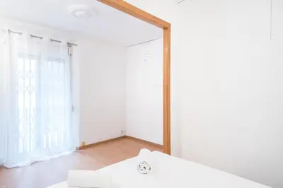 a mirror in a room with a white wall at Homenfun Barcelona Gracia in Barcelona