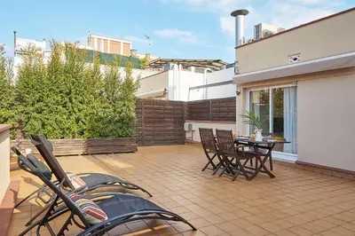 a patio with a table and chairs on a balcony at BBarcelona Sagrada Familia Flats in Barcelona