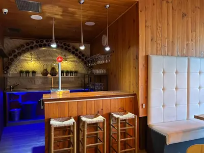 a large room with wooden ceilings and tables and chairs at CARIBBEAN Home in Montcada i Reixac