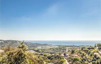 a view of the ocean from the top of a hill at Lovely Home In Sant Cebrià De Vallalta in San Cipriano de Vallalta