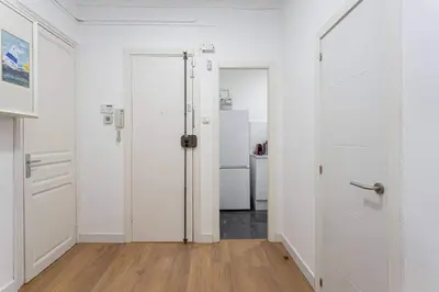 an empty room with white walls and white doors at Bright 3bdr Near To The Metro in Hospitalet de Llobregat