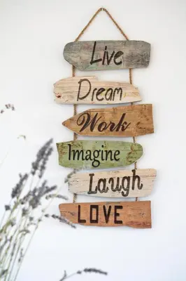 a wooden sign that reads live dream more imagine laugh love at Alojamiento MAS EL CASTELL DEL BRULL B&B in El Brull