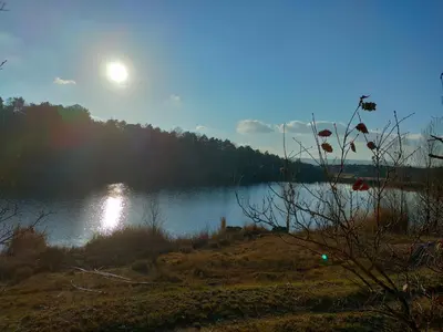 a view of a lake with the moon in the sky at Alojamiento MAS EL CASTELL DEL BRULL B&B in El Brull