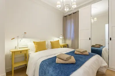 a bedroom with a bed with two towels on it at Moreryadom in Barcelona