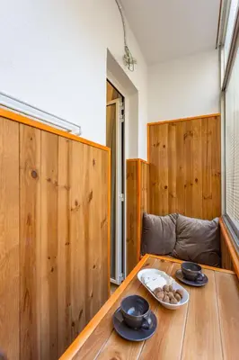 a wooden table with plates of food on top of it at Moreryadom in Barcelona