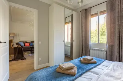 a bedroom with a bed with two towels on it at Moreryadom in Barcelona
