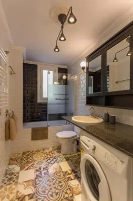 a bathroom with a washing machine and a sink at Moreryadom in Barcelona