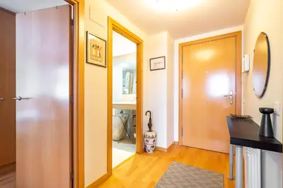 a hallway with a door leading to a bathroom at Stay U-nique Apartments Diagonal II in Barcelona