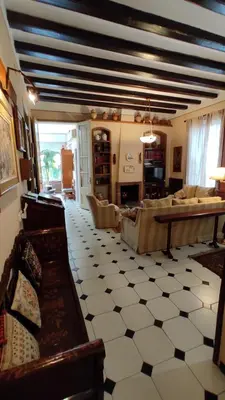 a living room with a couch and a table at Casa MO in Sabadell