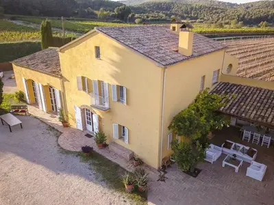 an aerial view of a yellow house with a patio at Lidia's Rural House (HUTB-0615) in Barcelona