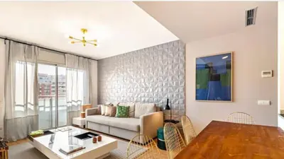 a living room with a couch and a table at HOSTAL BEDMATES in Barcelona