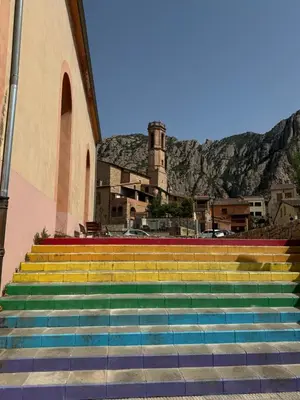 a set of colorful stairs in front of a building at Casa acogedora al pie de Montserrat in Collbató
