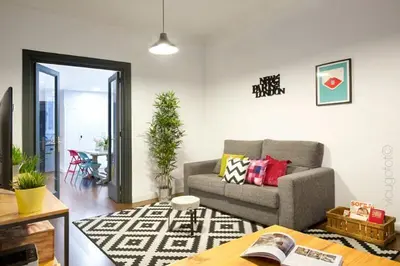 a living room with a couch and a table at Traveller House in Barcelona