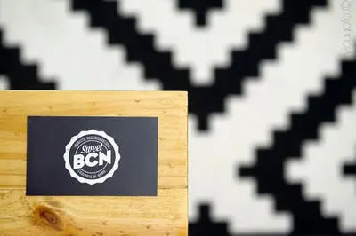 a picture of a wooden box with a logo on it at Traveller House in Barcelona