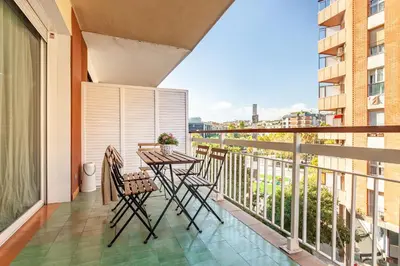 a balcony with a table and chairs and a view at Flateli Paris in Barcelona