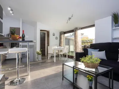 a living room with a couch and a table at Matarolux23 in Mataró