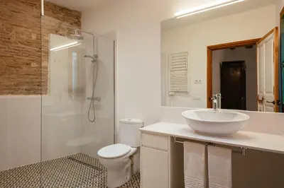 a bathroom with a sink and a toilet and a shower at Bellafila Gothic Terrace in Barcelona